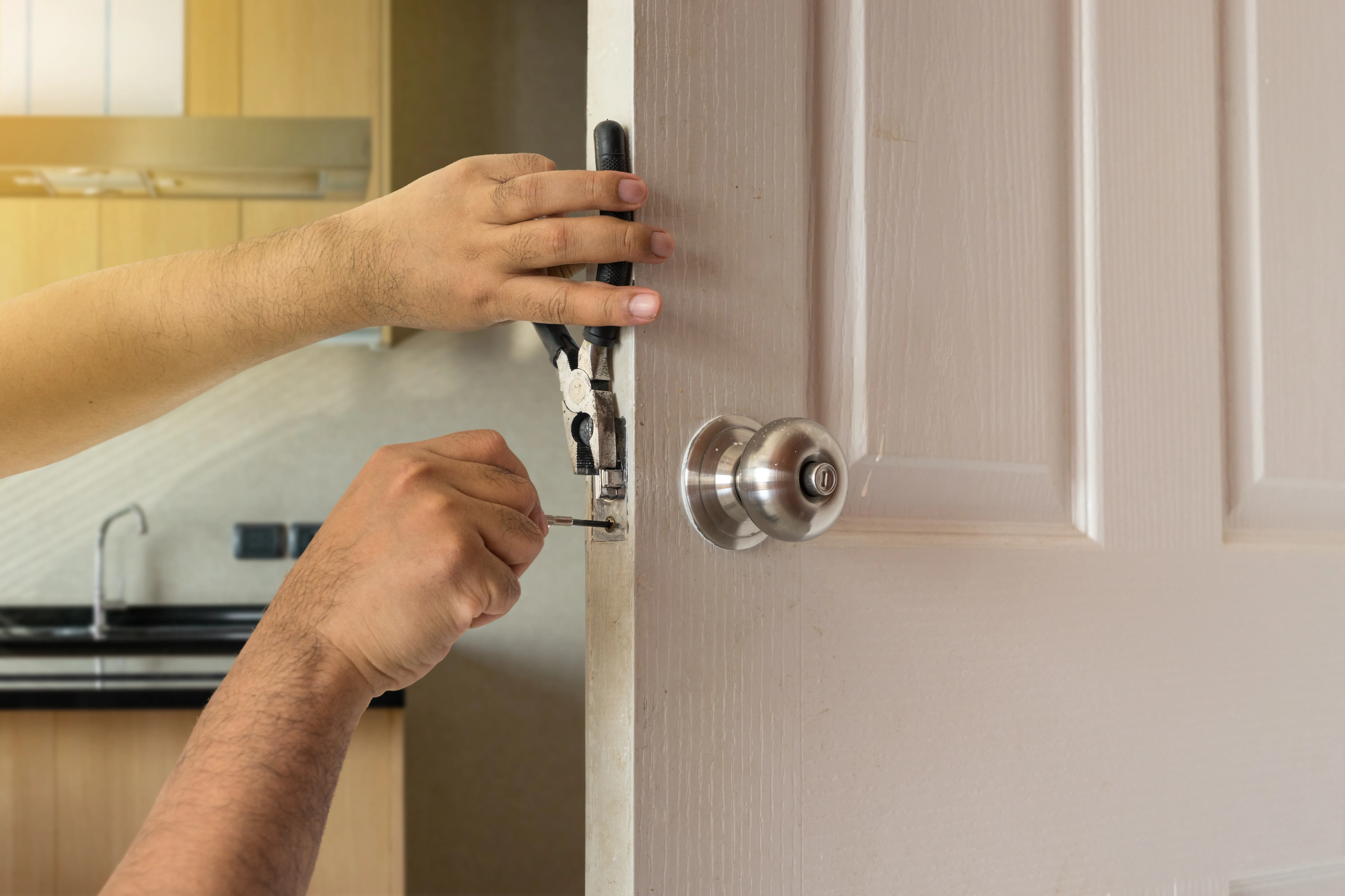 Man Working On Door Lock